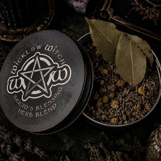 Herb blend container with 'Wicklow Witch' branding and Brigid's Blessing label on a dark background.